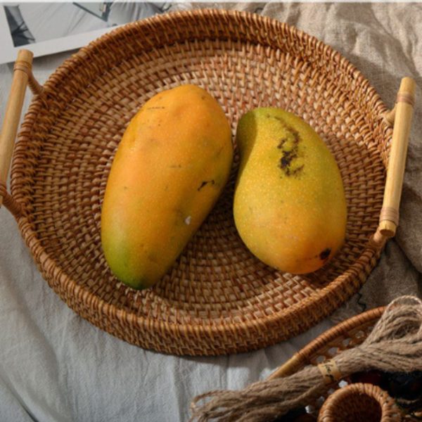 Round rattan tray with wooden handle for storing food